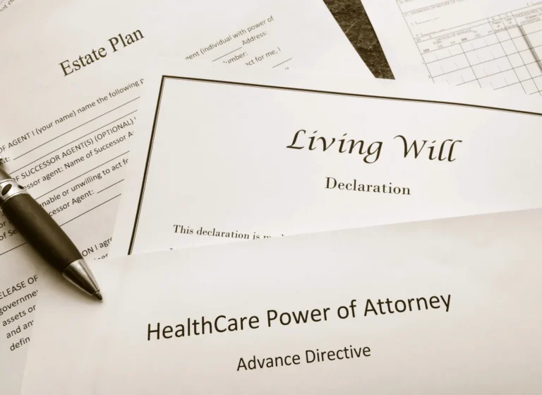 Stack of legal documents including Estate Plan, Living Will Declaration, and HealthCare Power of Attorney.